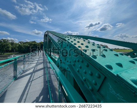 A pedestrian bridge over the Oder River in Opole, Poland, constructed using riveted technology.
