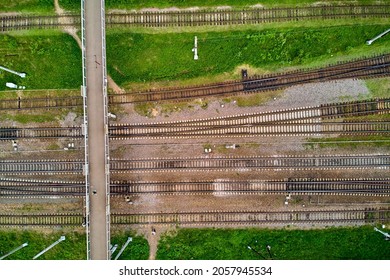 Pedestrian bridge over railway tracks, right angle aerial view - Powered by Shutterstock