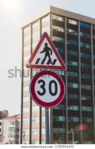 Pedestrian cross signboard.\
Caution signboard for pedestrian walk. Cross walk signboard. 30 km\
caution.