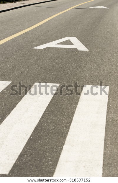pedestrian crossing
and bus lines in the
road