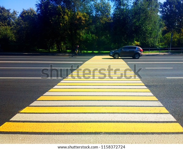 Pedestrian crossing with car and bicycle\
transportation\
background