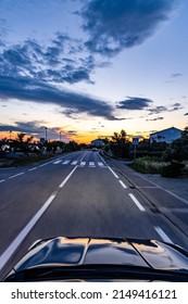 Pedestrian Crossing In The Evening, Seen From Oncoming Car	