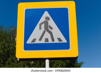Pedestrian crossing sign on the sky background - Shutterstock ID 1990820045
