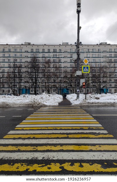 pedestrian crossing with traffic lights on the\
outskirts of the\
city
