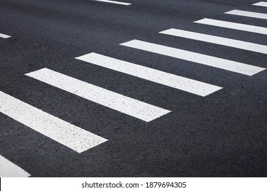 pedestrian crossing, white stripes on black asphalt, road markings zebra crossing, place to cross the road, traffic rules