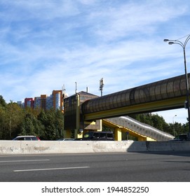 Pedestrian Crosswalk Raised Above The Expressway. A Building For A Safe Crossing Of The Highway