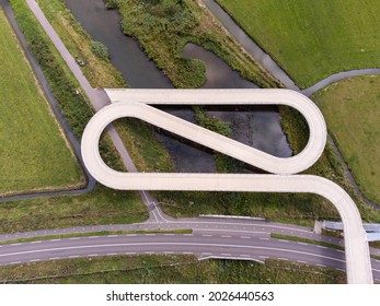 Pedestrian and cyclist bridge over the Amsterdams Rijn Canal,  waterway in Nigtevecht The Netherlands. Liniebrug - Powered by Shutterstock