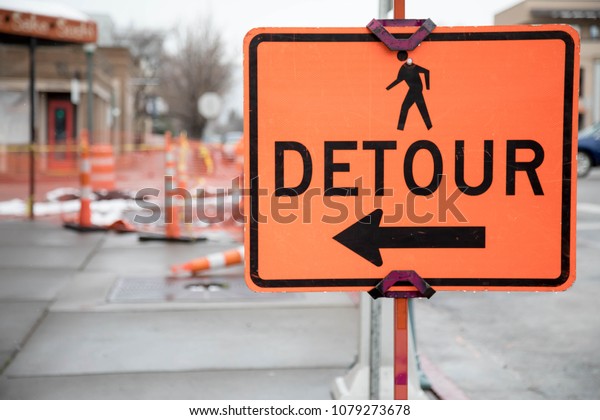 Pedestrian\
detour sign on a sidewalk in Durango,\
Colorado