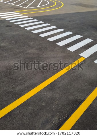 pedestrian paths and crossers with a combination of yellow and white