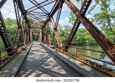 Pedestrian Rail Trail In The Catskills In Upstate NY Crosses The Springtown Bridge Over The Wallkill River  Near New Paltz In The Hudson Valley, On A Bright Summer Day.