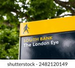 A pedestrian sign for the London Eye on the South Bank in London, UK.