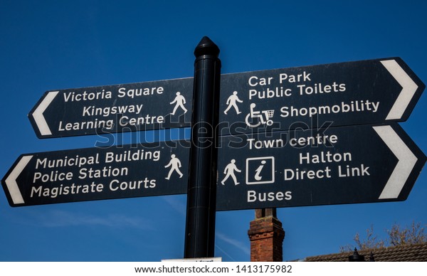 Pedestrian signs indicating multiple town centre\
locations Widnes April\
2019