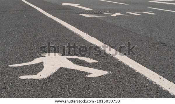 Pedestrian\
walkway in a busy car park or\
road	\
\
