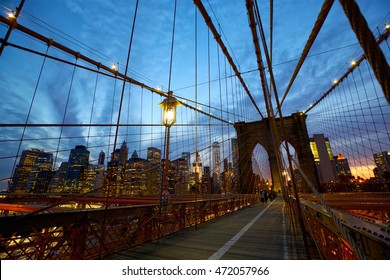 Pedestrian walkway on the Brooklyn Bridge at dusk, New York - Powered by Shutterstock