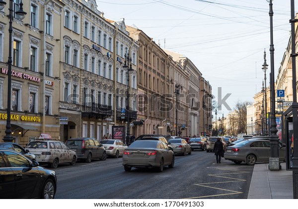 Pedestrians and cars on the Central street\
of Saint Petersburg. Russia, February\
2020