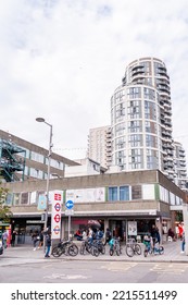 Pedestrians Walk Past Independent Shops On Station Parade In Barking Town Centre, With New Build High-rise Apartness In Barking, London, England, UK, September 22, 2022