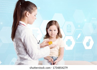 The Pediatric Doctor Does Checkup To A Little Girl In The Hospital