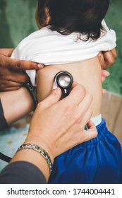 Pediatric Doctor Examining A Child. Malnutrition.