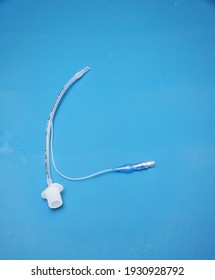 A Pediatric Endotracheal Tube Isolated  On Blue Background 