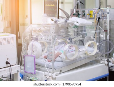 Pediatric patients sleep in incubators in the ICU.