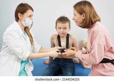 Pediatrician Checking Child Heart Rhythm With ECG Holter Monitor