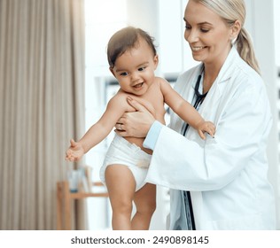 Pediatrician, doctor and baby with consultation, smile and appointment for wellness, medicare and joyful. Professional, person and kid in office, healthcare and progress with examination and checkup - Powered by Shutterstock