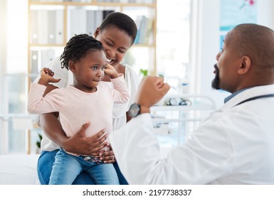 Pediatrician Doctor With Black Family, Baby And Mother In Clinic Or Hospital Checkup Appointment For Growth Wellness. Child In Strong Muscle Flex For Calcium With Fun Male Medical Pediatrics Expert