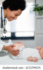 Pediatrician Doctor Concept. Children Medical Care. Infant Child Examined By Female Pediatrician In Clinic Office. Child Visiting Doctor For Health Check-up. Doctor Examine Little Patient.