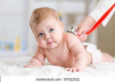 Pediatrician Doctor Examines Baby With Stethoscope Checking Heart Beat