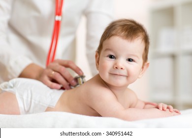 Pediatrician Doctor Listens To Baby Heartbeat With Stethoscope