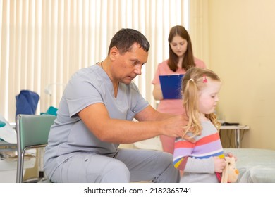 Pediatrician Examining A 4 Year Old Girl In A Doctor's Office