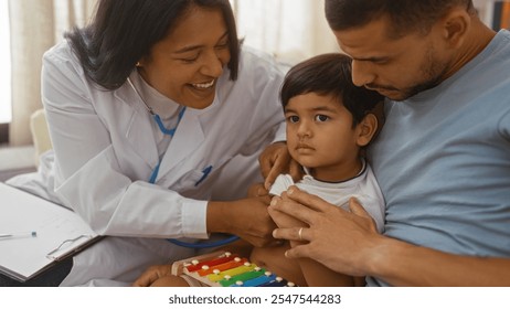 Pediatrician examining young child held by father in apartment living room - Powered by Shutterstock