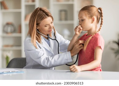 Pediatrician Lady With Stethoscope Listening Lungs Of Coughing Little Girl During Checkup, Professional Pediatrist Doctor Woman Checking Health Condition Of Sick Female Child, Closeup Shot