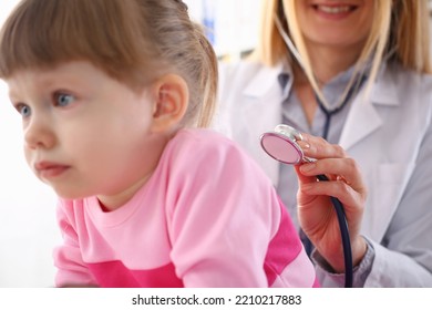 Pediatrician Listens To Lungs Of Small Child Girl With Stethoscope