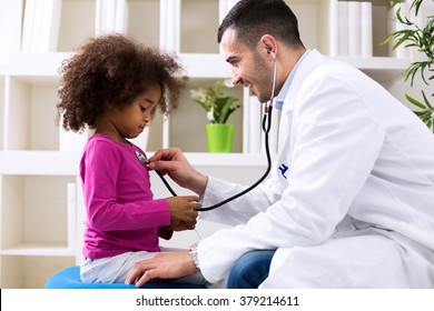 Pediatrician and little african girl at hospital - Powered by Shutterstock