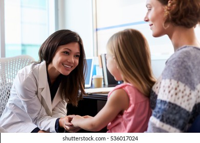Pediatrician Meeting With Mother And Child In Hospital
