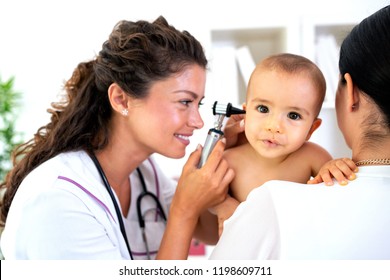 Pediatrician providing healthcare for her baby patient in the office of a specialized clinic for children 