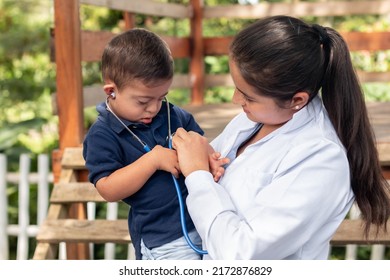 A Pediatrician Teaches How To Listen To The Heart Of A Child With Down Syndrome. Raising Awareness About Down Syndrome. A Doctor Checks A Child With A Stethoscope.