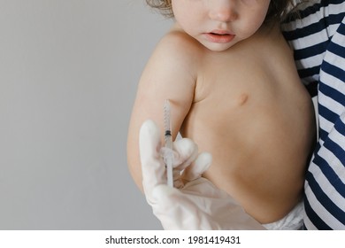 pediatrician vaccinating a little child in the pediatric clinic