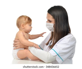 Pediatrician Woman Doctor In Medical Mask Holding In His Arms Child Baby Patient Physical Therapy Closeup Composition Isolated On A White Background