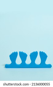 Pedicure Kit. Finger Separators On A Blue Background 