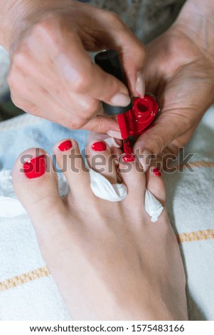 pedicure process macro closeup. pedicure process and spa procedure macro closeup. Concept body care. nail beauty process, polishing and painting. Master does pedicure for client. Pedicure process