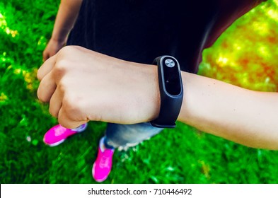 Pedometer on the hand of the girl. fitness watch. gadget. heart rate measurements