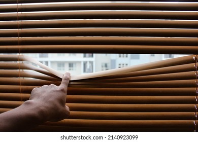 Peeking through the venetian blinds. Illustration of people peeking. See through blinds. 