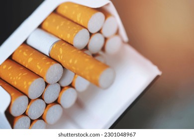 peel it off Cigarette pack prepare smoking on white wooden background. Packing line up. photo filters Natural light.