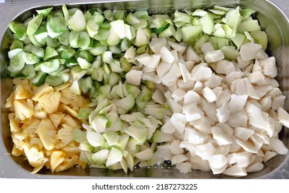 Peel And Sliced Pineapples, Jicama, Cucumber And Kedondong On A Stainless Steel Box.