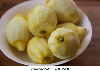 Peeled Amalfi Lemons In Preparation Of Homemade Limoncello In White Plate