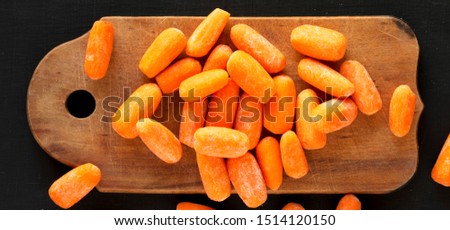 Similar – Image, Stock Photo Carrots from small organic farm. Kid farmer hold carrots