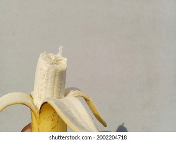 peeled banana that has been bitten