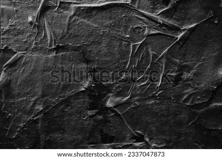 Peeled black paper texture background